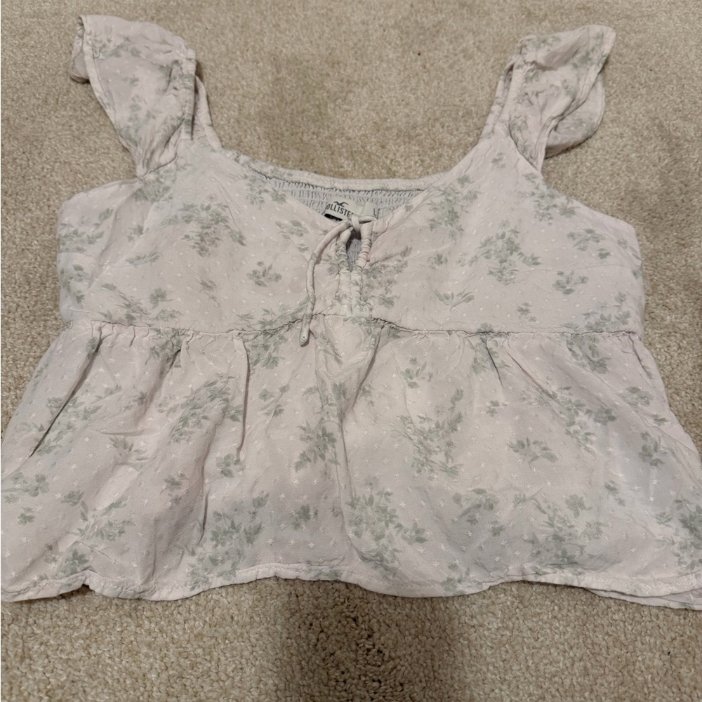 Hollister white top with green flowers